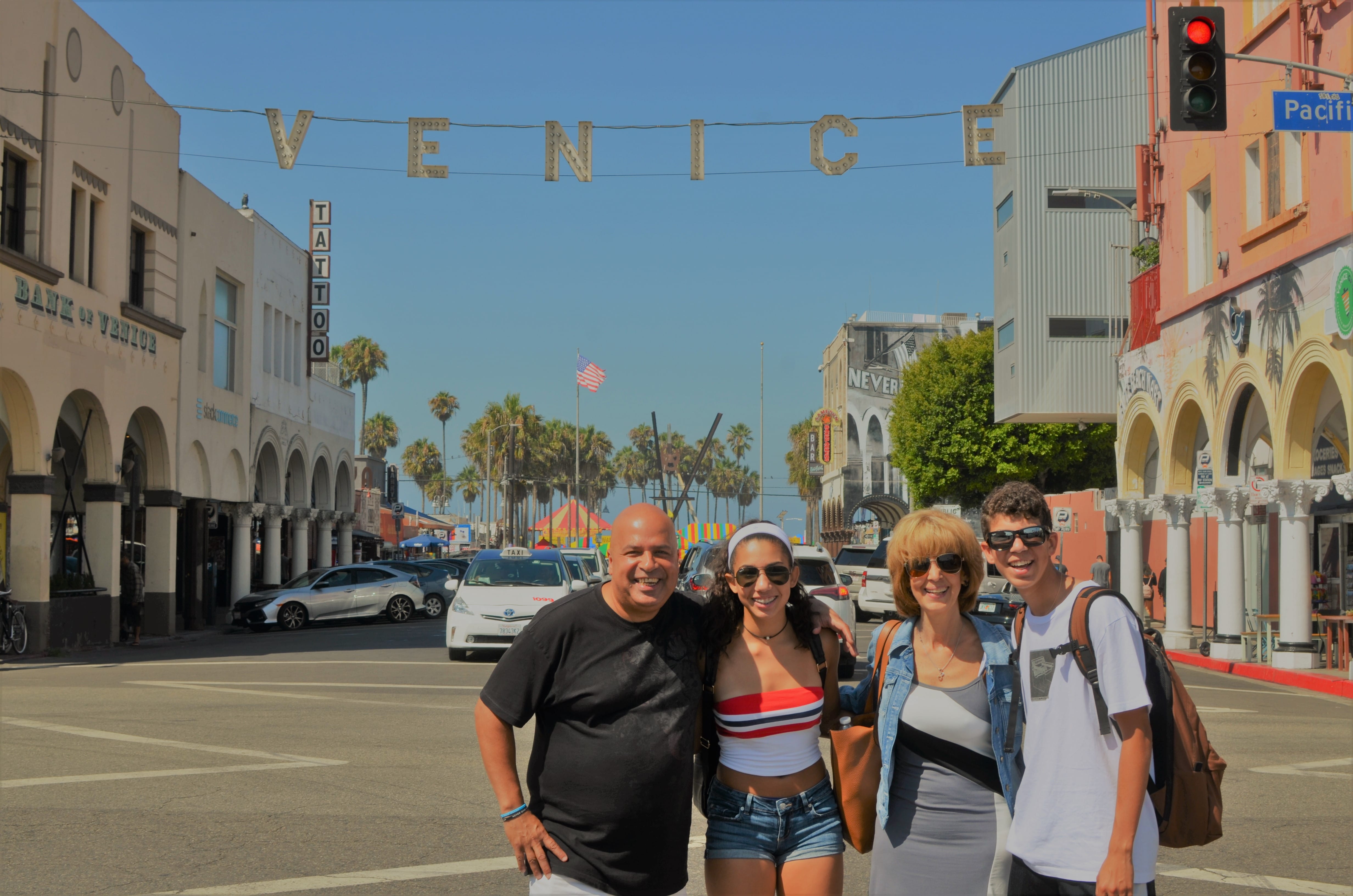 Photo in front of Venice Beach Sign - A Day in LA Tours