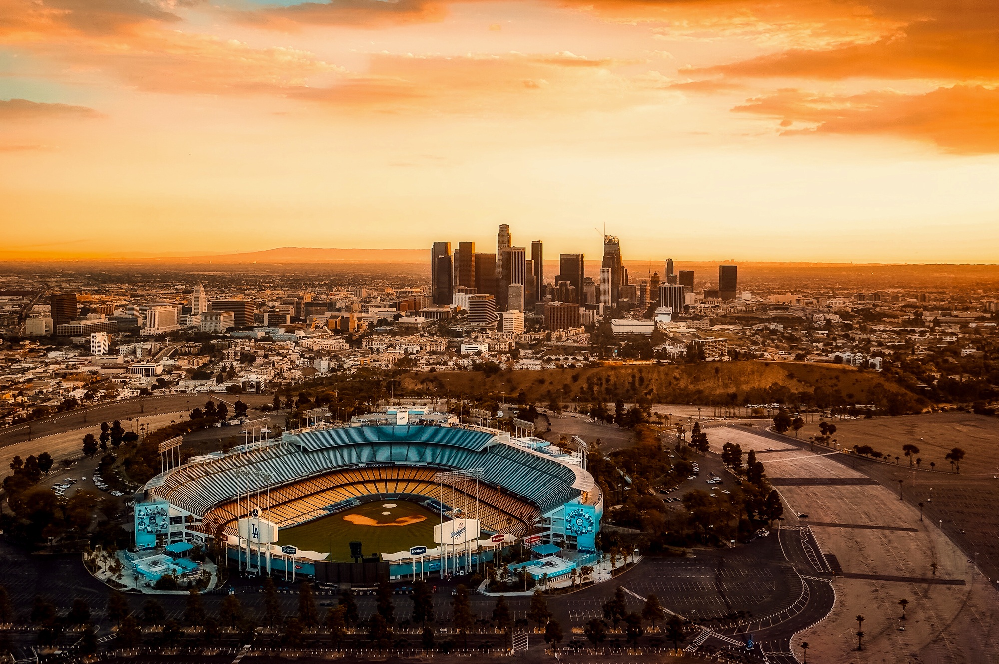 The sun setting over Dodger Stadium, an arena in Los Angeles
